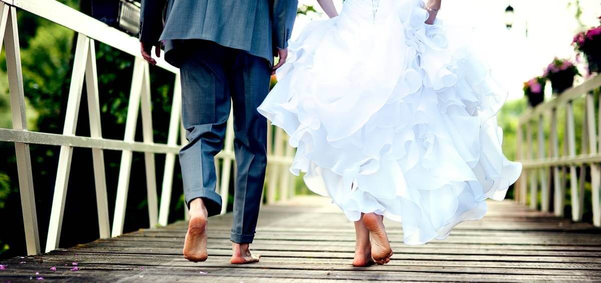 Married barefoot couple at their wedding